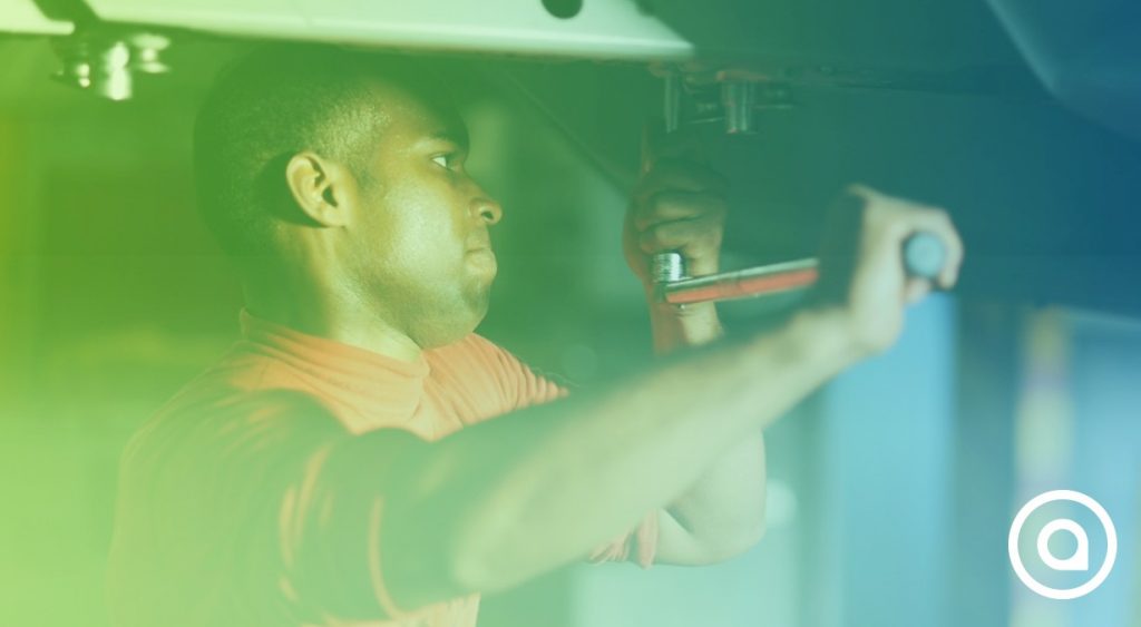 A man is working on a car